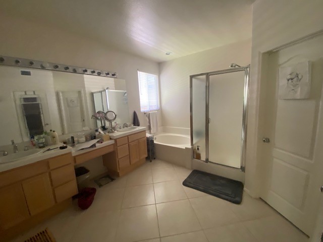 The bathroom before: an oak vanity, a corner tub and a framed shower
